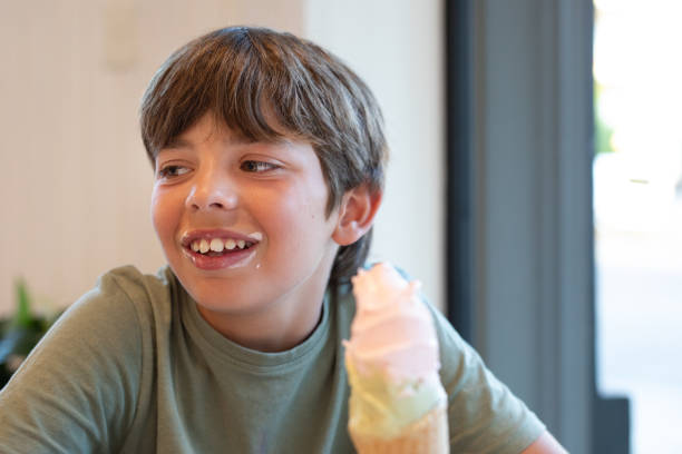 View of a boy eating an ice cream