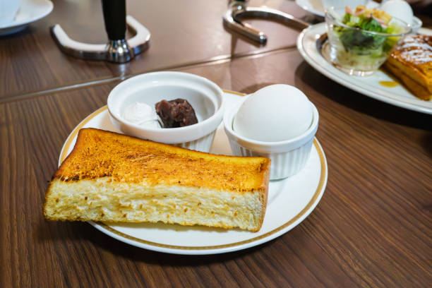 istock Breakfast at a cafe.
A plate of toasted bread, boiled eggs, and sweet bean paste. 2194317359