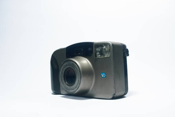 A close-up angled shot of a vintage film camera, highlighting its classic design and retro aesthetics against a clean white background. Great for photography and technology visuals.