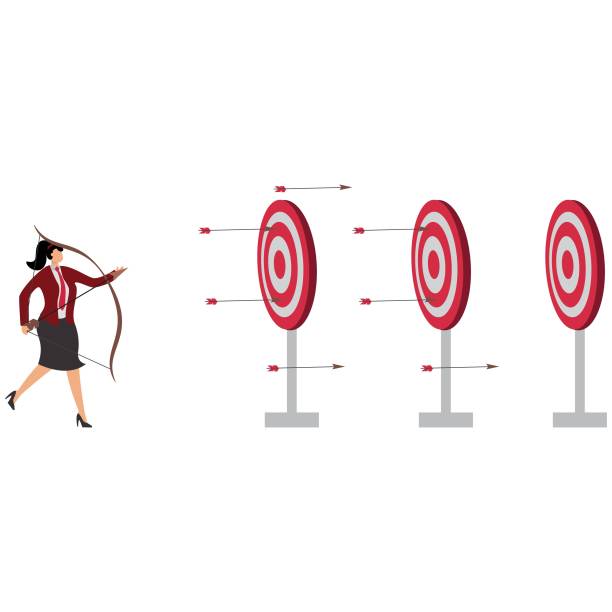 istock Businesswoman Throwing Arrow at Target Aiming for Big Goals 2194321985