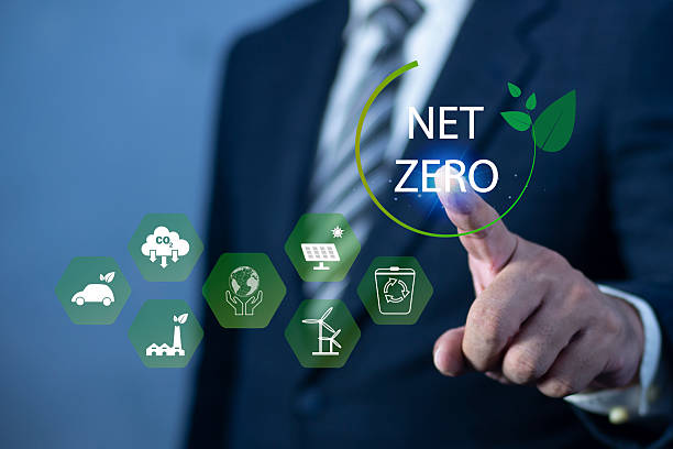 istock Businessman touching Net Zero icon. natural environment A climate-neutral long-term strategy greenhouse gas emissions targets. concept of carbon neutral and net zero. 2194325311