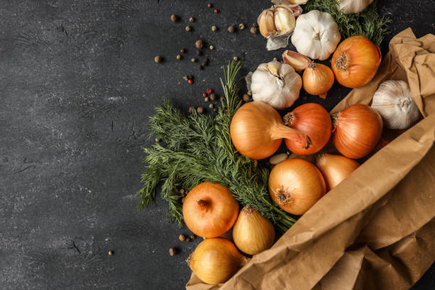 istock Fresh onions, garlic, dill, and peppercorns arranged on a dark rustic background. Perfect for culinary concepts, food styling, or showcasing organic ingredients 2194325381