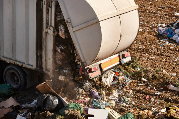 istock Truck unloading garbage on an open air dump. Waste treatment 2194331468