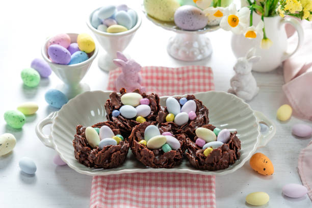 istock Easter egg nest cakes, cornflakes covered in milk chocolate topped with a miniature easter egg 2194332415