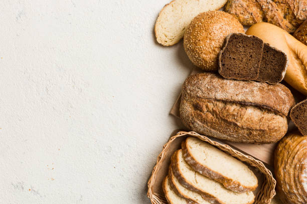 istock Homemade natural breads. Different kinds of fresh bread as background, top view with copy space 2194334712