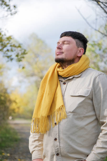 istock young man enjoying autumn days breathing fresh air 2194335770
