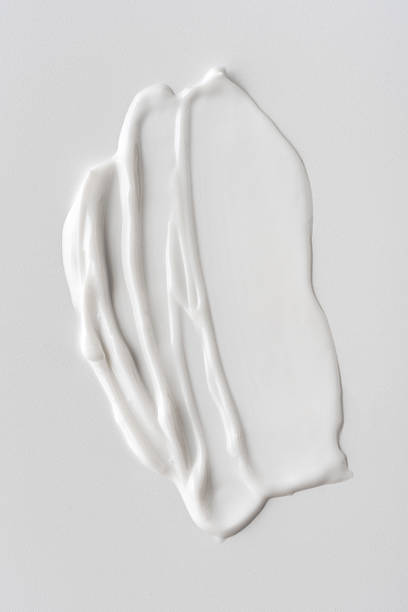 istock Closeup of white cream texture on a neutral background 2194336215