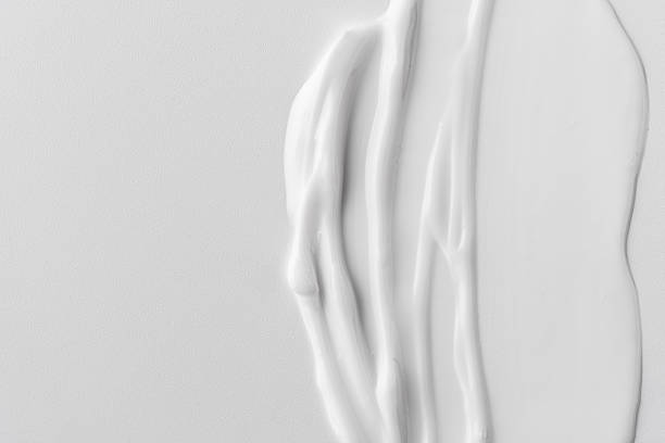 istock Closeup of white cream texture on a neutral background 2194336217