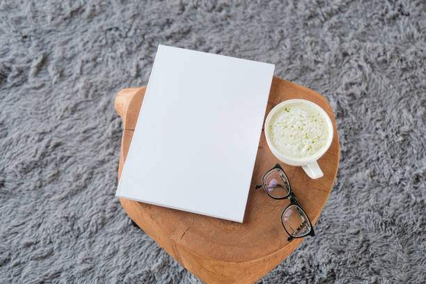 istock blank magazine mockup on coffee table with green matcha tea near window 2194337239