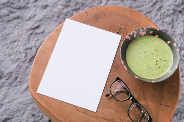 istock blank paper sheet mockup on coffee table with green matcha tea 2194337549