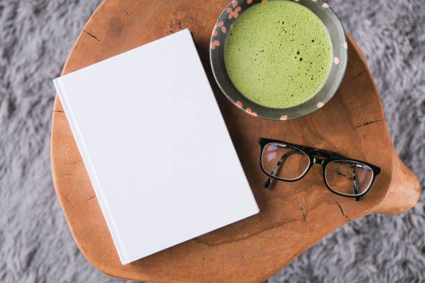 istock blank book cover mockup on coffee table with green matcha tea 2194337715