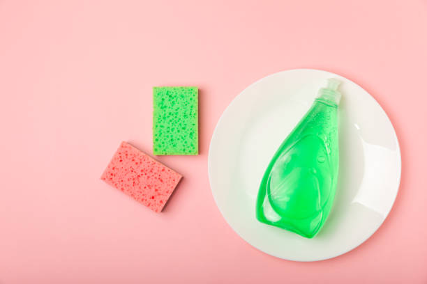 istock Colorful dish sponges on textured background. Kitchen sponge. Cleaning concept, cleaning service. Dishwashing liquid with clean and dirty dishes plate. Place for text, copy space. Wash the dishes. 2194338106