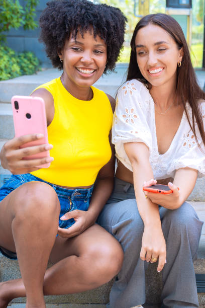 istock Happy friends taking a fun selfie outdoors.Vertical 2194338962