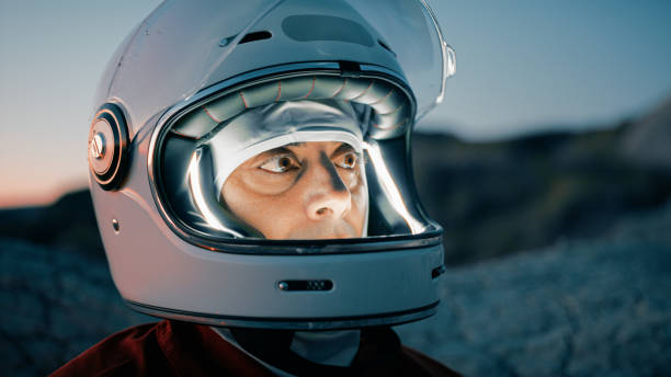 istock Astronaut With Helmet Prepares For Cold Night In Uninhabited Planet 2194339005