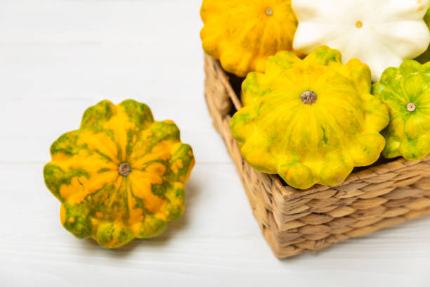 Pattypan zucchini on a textured kitchen table. squash. Fresh organic pattypan squashes on background. Vegan. Farmer's Market. Patisson. Space for text. Copy space.