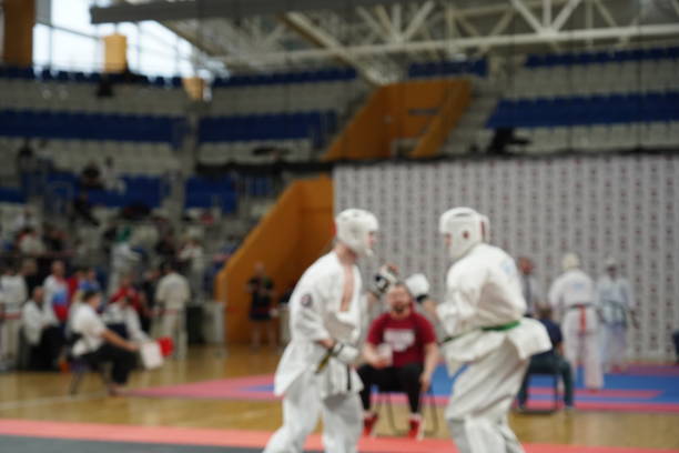 istock Blurred defocused image with two karate practitioners sparring on a tatami mat. 2194342933