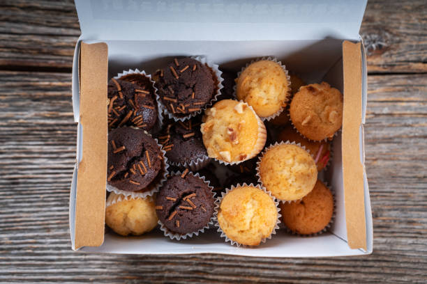 istock Box of assorted mini muffins with chocolate and nuts 2194343248