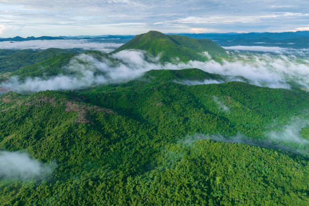 A stunning aerial view of the morning mist that covers the surrounding mountains. Nong Ya Plong District in Phetchaburi, Thailand.