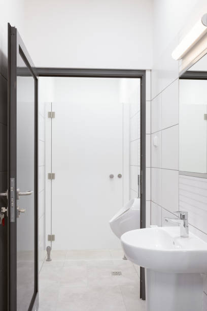 istock Modern Public Restroom with Sink, Urinal and Toilet 2194344234