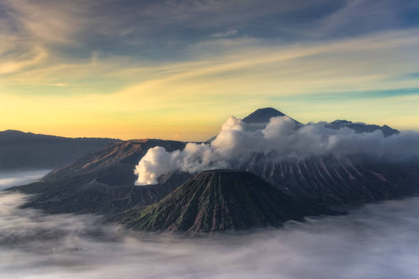 istock Experience the breathtaking Sunrise over a stunning Volcanic Landscape, enveloped by Mist and Clouds 2194345876
