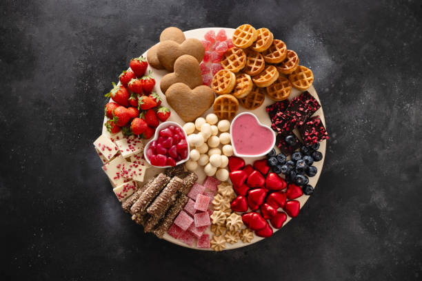 Charcuterie Valentines Day board with chocolate sweets.
