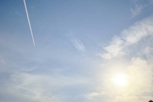 The sky, the sun and contrails