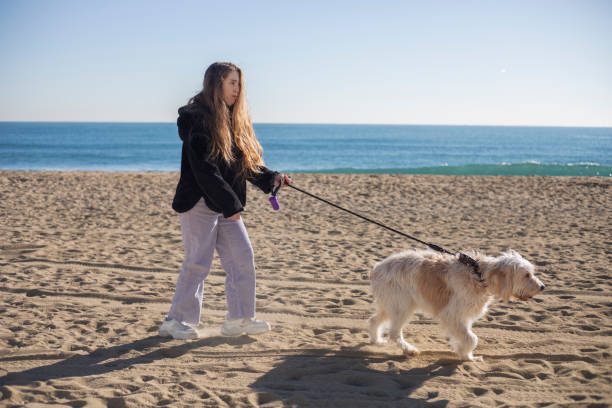 istock Young woman with cerebral palsy walking her dog 2194349740