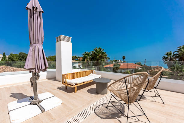 istock Wooden chairs on luxury rooftop terrace with Ocean view 2194349830