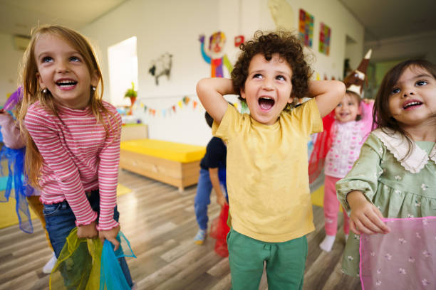 istock Children dancing in the playroom 2194352498