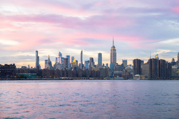 New York rising over Hudson river during sunset