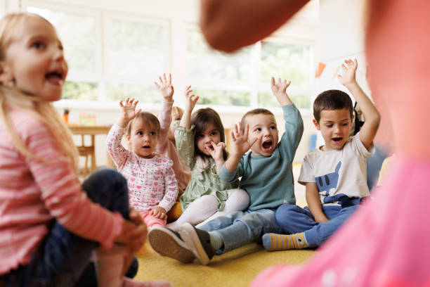 istock Group of kids having fun in kindergarten 2194353481