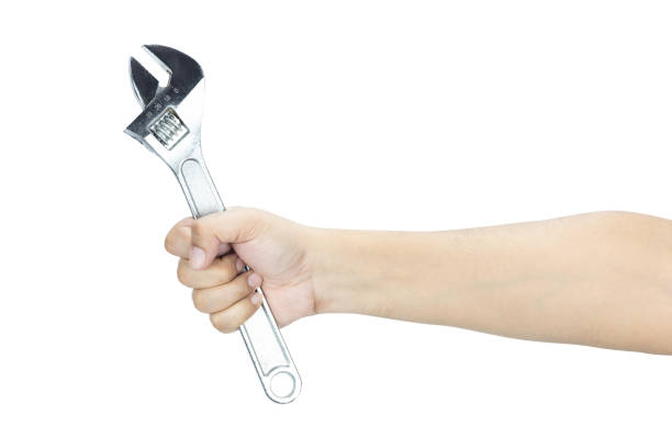 istock Man hand holding adjustable wrench isolated on white background with clipping path. 2194363148