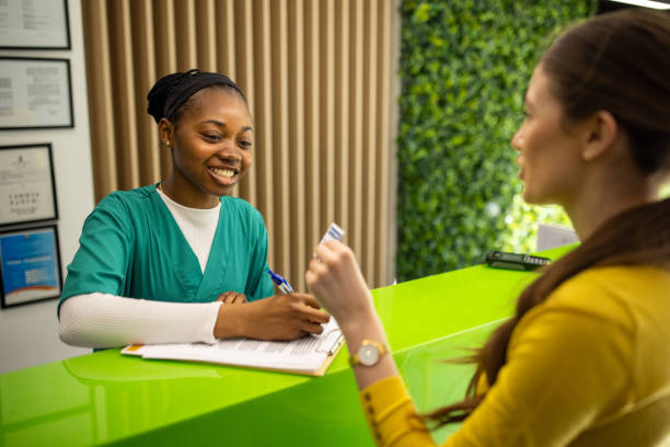 istock Medical worker talking with patient at the clinic 2194363594