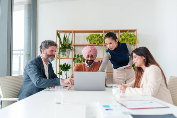 istock Diverse Business Executives Collaborating in Modern Boardroom 2194364503
