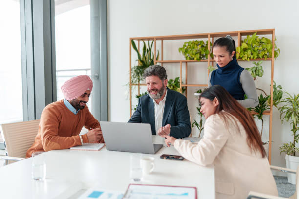 istock Diverse Business Executives Collaborating in Modern Boardroom 2194364507