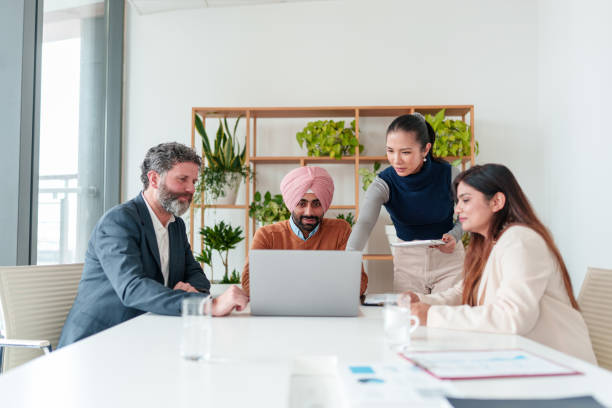 istock Diverse Business Executives Collaborating in Modern Boardroom 2194364510