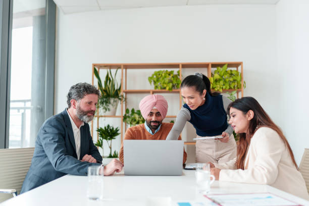 istock Diverse Business Executives Collaborating in Modern Boardroom 2194364541