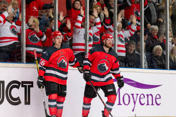 istock Two Hockey Players Celebrate Amid a Cheering Crowd 2194366291