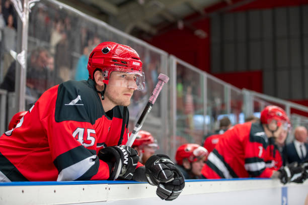 istock Intense Focus: Ice Hockey Player Leaning on the Dasher Board 2194366440