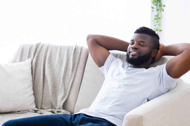 istock Relaxed Man Enjoying Leisure Time at Home in a Cozy Living Room Setting 2194366807