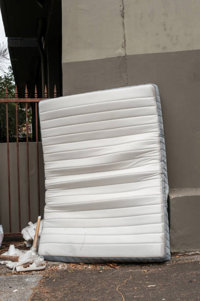 istock Discarded old mattress on a footpath against a wall. 2194367305