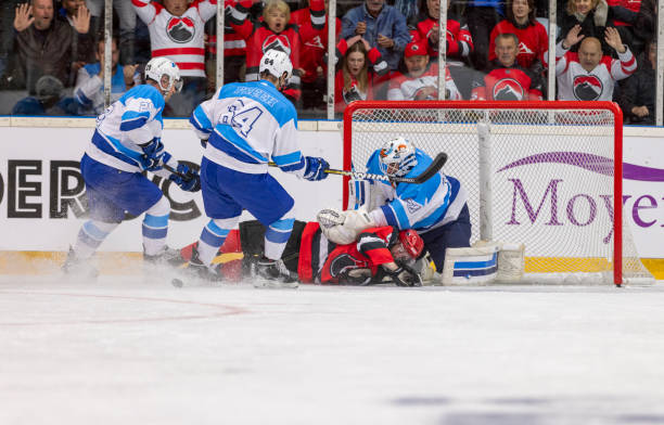 istock Intense Hockey Moment by the Goalpost 2194367521