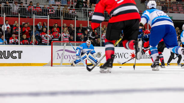 istock Professional Ice Hockey Game: Goalie Defending the Net 2194367623