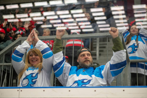 istock Ice Hockey Game: Mature Couple Cheering in the Stands 2194367910