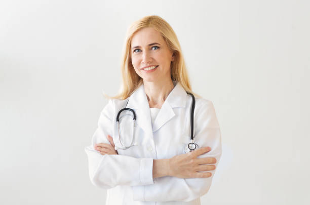 istock Happy Doctor With Arms Crossed Over Grey Background 2194368810