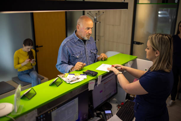 istock Man talking to a medical worker at the clinic 2194369362