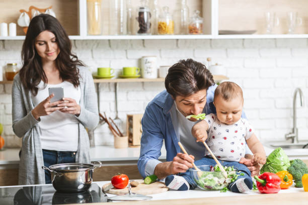 Family Cooking Together in a Home Kitchen While Enjoying Quality Time