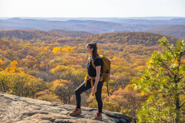 istock Woman backpacker solo exploring upstate New York during peak Autumn 2194371619