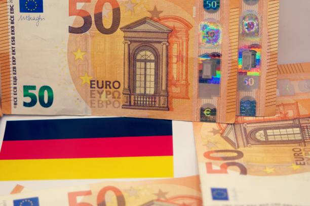 istock Germany flag with european banknotes 2194372428