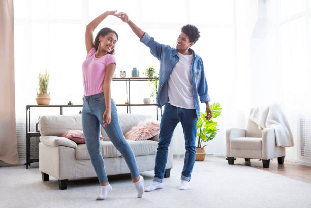 istock Romantic Dance Between a Couple in a Bright Living Room During Daytime 2194372558